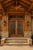 Puerta Tenampa (Model 2011-PAN-SUP) – Handcrafted custom solid wood exterior double door featuring an arched dual-panel...