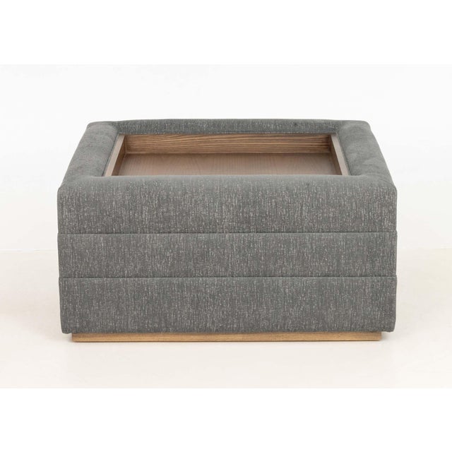 Vanguard Boyden Gray Linen Upholstered Ottoman, with inset mahogany tray to the center. 17" H x 35" W x 35" D. Provenance:...