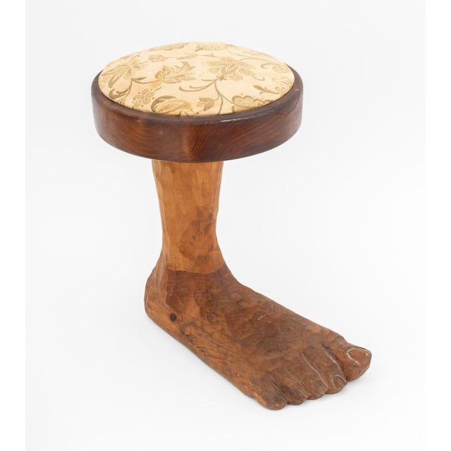 Folk Art Carved Wood "Foot" Stool, with cream floral upholstery, signed "Amidon" to underside. 15" H x 14.5" W x 9" D....