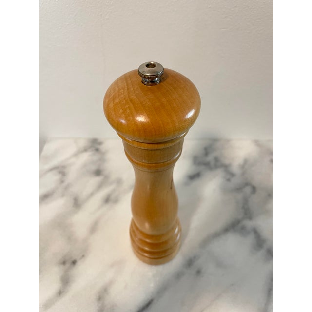 This vintage light wood pepper grinder is made my Peugeot, France. This sturdy culinary tool will bring style and function...