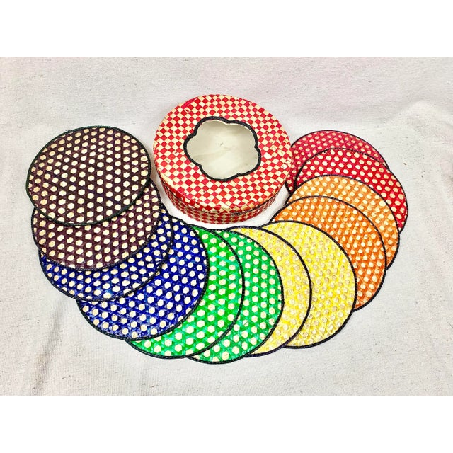 Fun vintage set of trivets. Made of raffia. Two of each in red, orange, yellow, green, blue and purple. Total of 12 plus...