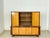 A beautiful vintage highboard, perfect for use as a bar cabinet. This piece of furniture impresses with its elegant design...