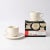 Set of two cream porcelain cups with saucers. Come from the "La Bella Tavola" series designed by Ettore Sottsass for...