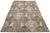 This Modern hand-loom wool rug showcases a stunning beige-taupe field with an all-over abstract design. This rug measures...