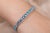 This is part of Chairish’s Fine Jewelry assortment. This Sparkling Diamonds and Blue Topaz Tennis Bracelet in 18K gold...