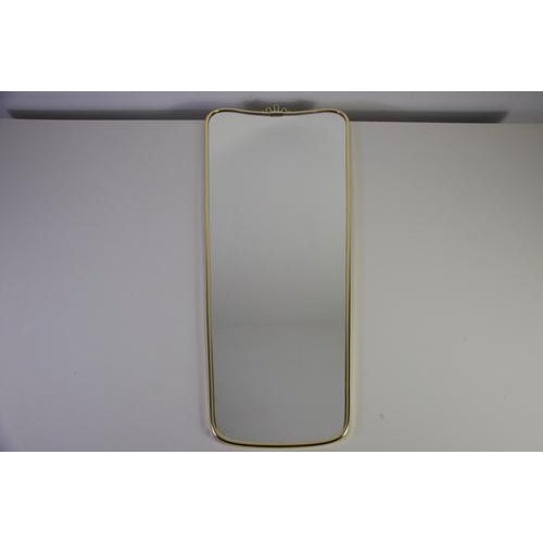 This refined Italian wall mirror from the 1960s is a beautiful example of understated mid-century design. The piece...