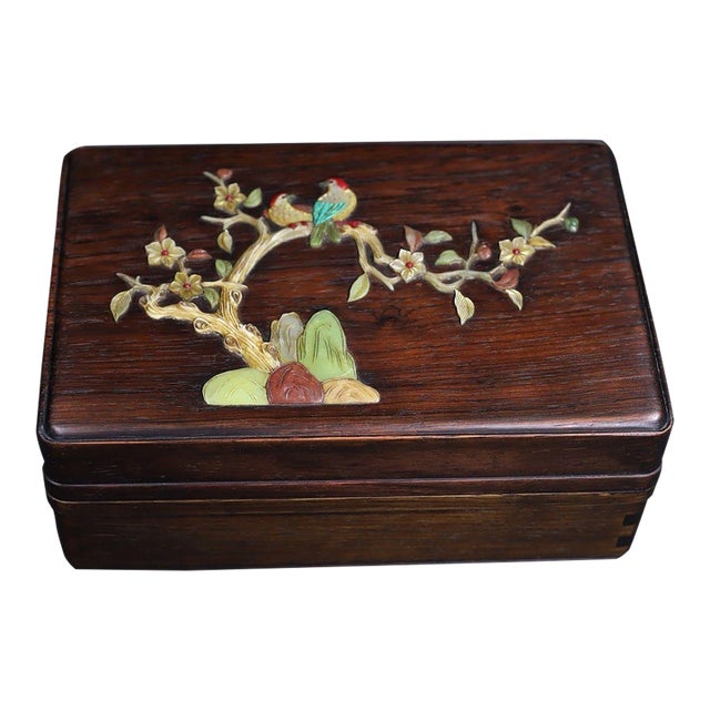 A beautifully crafted Chinese rectangular box, likely made of Huali (rosewood). The box features a hinged lid that opens...