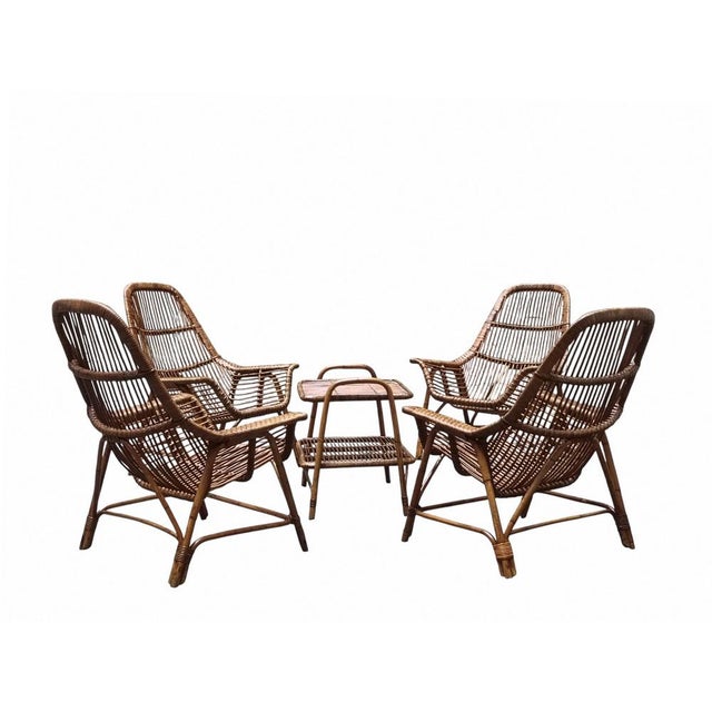 Iconic and collectible Italian design rattan set designed by George Coslin for Gervasoni, an Italian company renowned for...