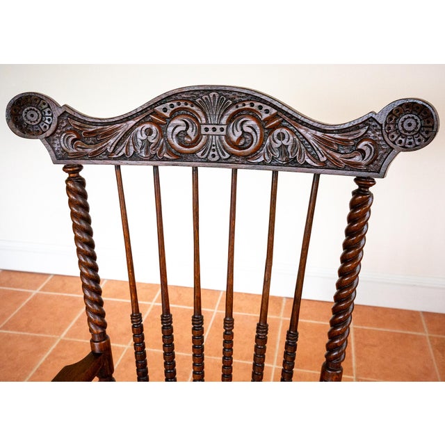 A gorgeous, extremely impressive and very rare, ornately carved large Windsor armchair in wonderful antique condition....