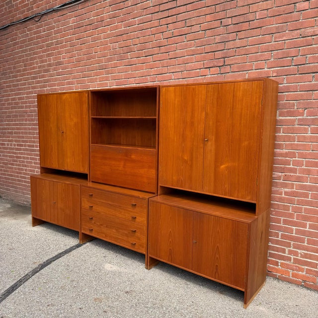 Rare three-bay teak wall unit designed by Hans J. Wegner for Ry Møbler, Denmark, circa 1960s. A really beautiful example...