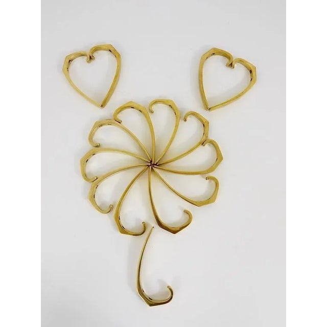 Austrian modernist brass wall hook, executed in the 1950s by Baller Austria. Gently polished by hand, in good condition...