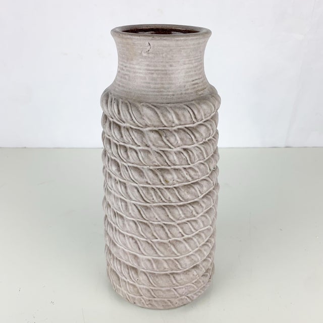 Fantastic vintage W German pottery vase with rope like texture in gray. Marked on bottom. Great mid century vibes. Great...