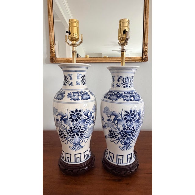 Chinoiserie style blue and white hand painted porcelain lamps. These are vintage Chinese vases made into lamps and...