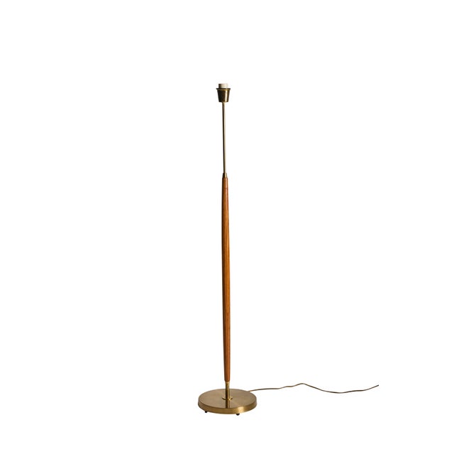 Swedish floor lamp from the 1950s, showcasing the elegant material combinations and meticulous craftsmanship...