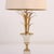 French brass and polished steel table lamp attributed to Maison Charles C 1950. Central shaft adorned with outward flaring...
