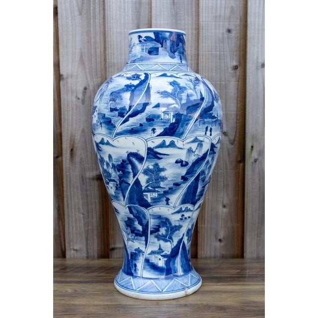 A striking large Chinese blue and white porcelain vase, standing an impressive 49 cm high and displaying the timeless...
