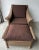 Immaculate Tommy Bahama chair and ottoman in outdoor weathered resin wicker . Brown canvas cushions with removable...