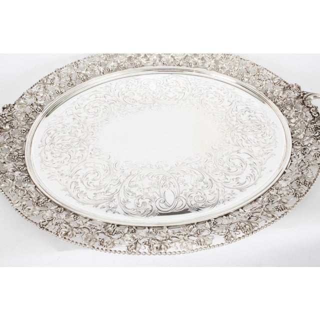 This is a momumental beautiful antique English Victorian oval silver-plated twin handled tray, circa 1870 in date. This...