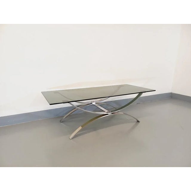 Vintage coffee table from the 70s, rectangular smoked glass tray, chromed metal foot design in reversed arcs, very good...
