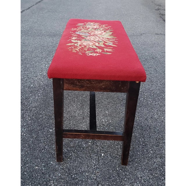 Elegant mahogany bench with a red floral needlepoint seat. Place it at the foot of a bed, at a piano or use it for extra...