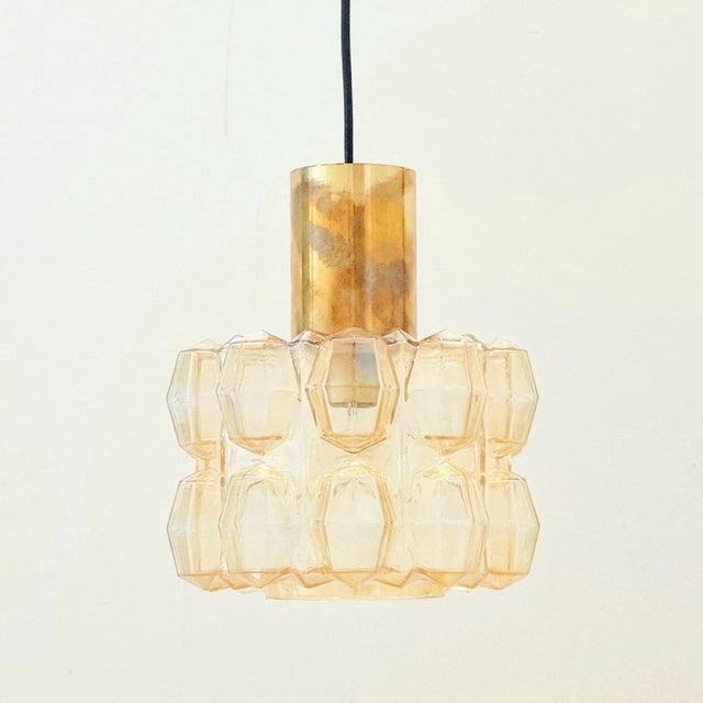 Stunning mid-century modern pendant by Helena Tynell for Limburg, Germany's leading glasswork, renowned for its premium...