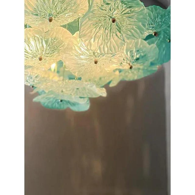 Impressive and luxury flowers in clear and sanded azure murano glass. exclusive design by simoeng. a luxury piece of...