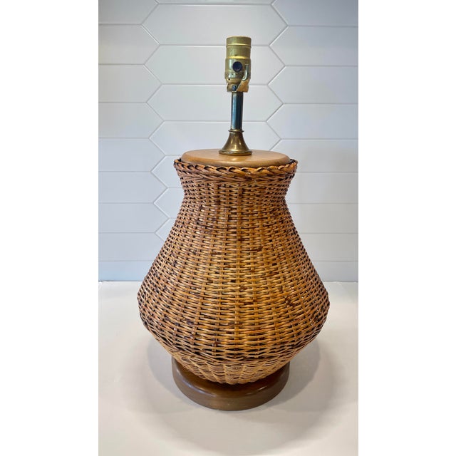 Boho perfection in a generous size, attributed to George Kovacs but no label remains. Tightly woven natural wicker/ rattan...