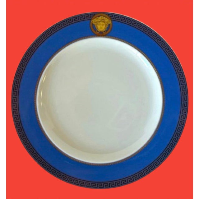 Fantastic Vintage Versace for Rosenthal round barocco themed porcelain plates in blue and gold colors made in Germany.