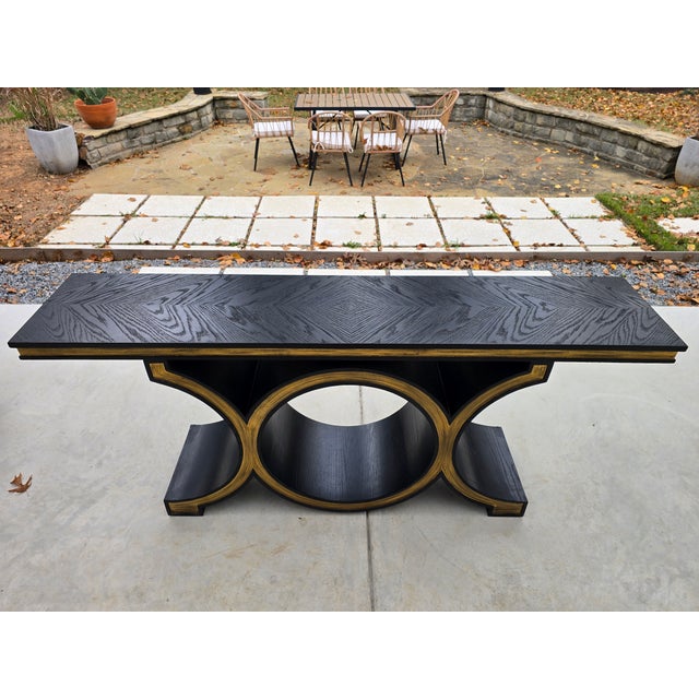 ▪️Global Views Black / Gold Console Table ▪️Solid Wood, finished in satin black lacquer finish with gold leaf details...