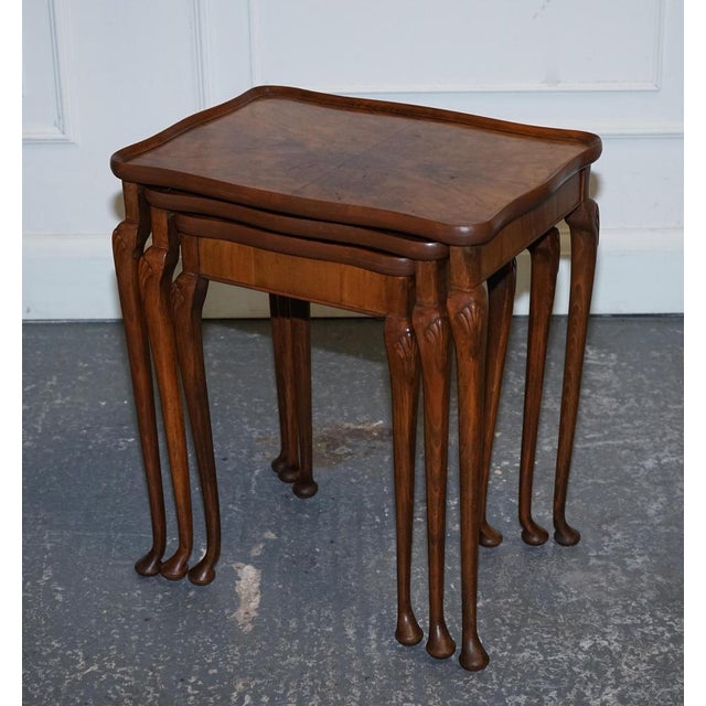 This stunning 1920s Art Deco Burr Walnut Nest of Three Tables. A striking example of the era’s bold design aesthetic,...