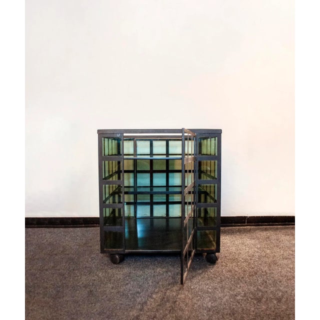 Liquor trolley with iron and glass structure, vinyl details. Model Go Go Designer Anna Anselmi Producer Bieffeplast 80's I...