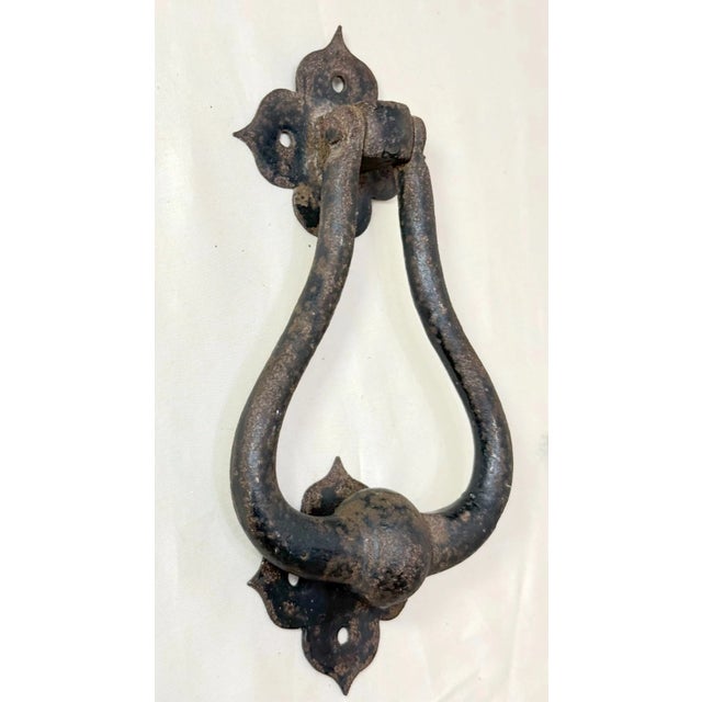 This antique Arts and Crafts hammered and wrought iron front door knocker is a unique and distinctive architectural piece....