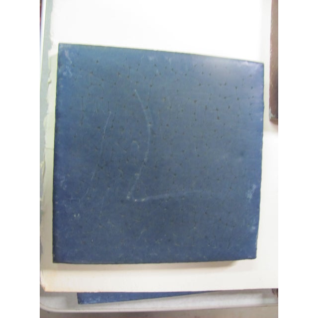 Two original, vintage Ceramic tiles Made by GRUEBY POTTERY of Boston MA. They are a scarce blue color. Each tile measures...