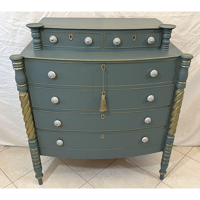 Very pretty antique Sheraton Style bowfront chest of drawers from the late 19th century. The six-drawer dresser is...