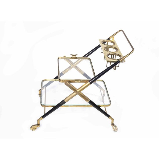 Vintage bar cart is an original design item attributed to the Italian designer Cesare Lacca in the 1970s. A black and...