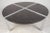Impressive vintage modern round coffee table features four individual marble inserts and a thick chrome base. The sleek...