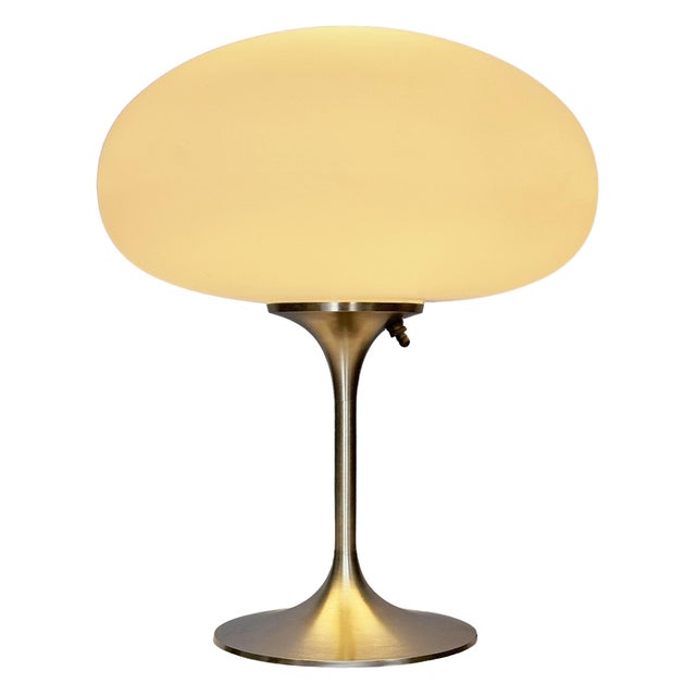 ENJOY FREE CONTINENTAL USA SHIPPING! A sleek stemlite table lamp made by Design Line. It features a cast aluminum main...