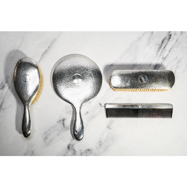 A superb example of Japanese sterling silver craftsmanship, this elegant circa 1920 dressing table set is a remarkable...