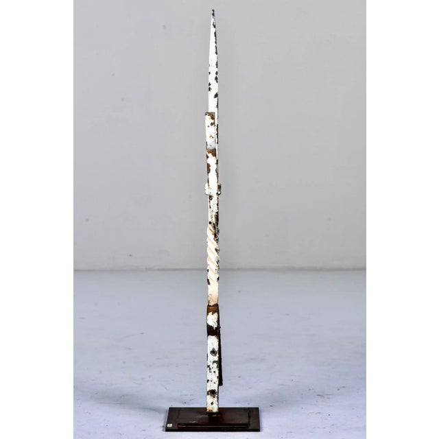 Found in England, this circa 1900 iron finial has ivy leaves and a white painted finish. Mounted on a custom iron display...