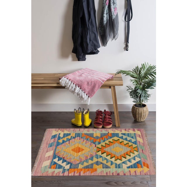 Elevate the elegance of your home with this stunning hand-woven tribal Kilim wool rug. Meticulously crafted on a loom by...