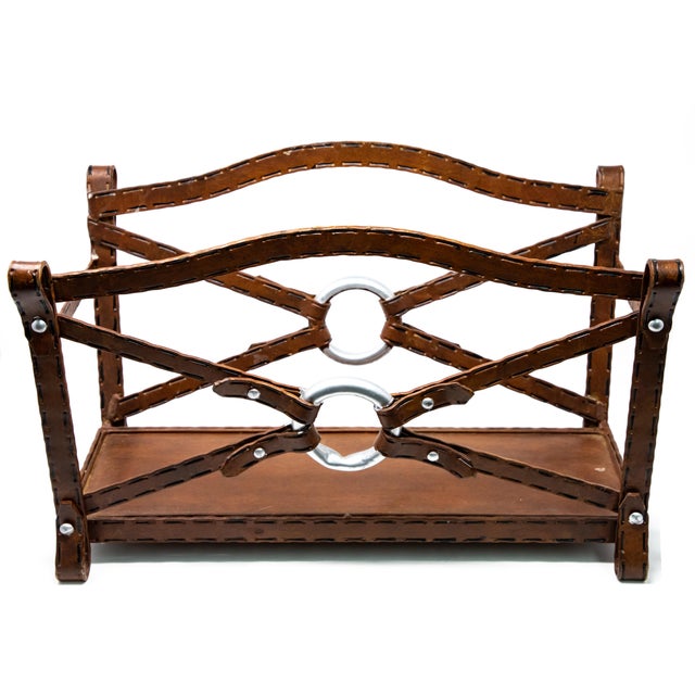 Offering this beautiful metal magazine rack in a western motif. Made of all metal it looks like leather. Stitch markings...