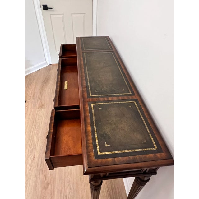 Elevate your entryway, hallway, or living space with this elegant vintage Maitland-Smith console table. Crafted with the...