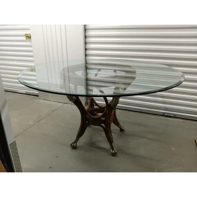 Vintage rattan, bamboo and glass top dining table, with chippendale claw feet. A unusual piece. Unmarked, but in the...