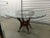 Vintage rattan, bamboo and glass top dining table, with chippendale claw feet. A unusual piece. Unmarked, but in the...
