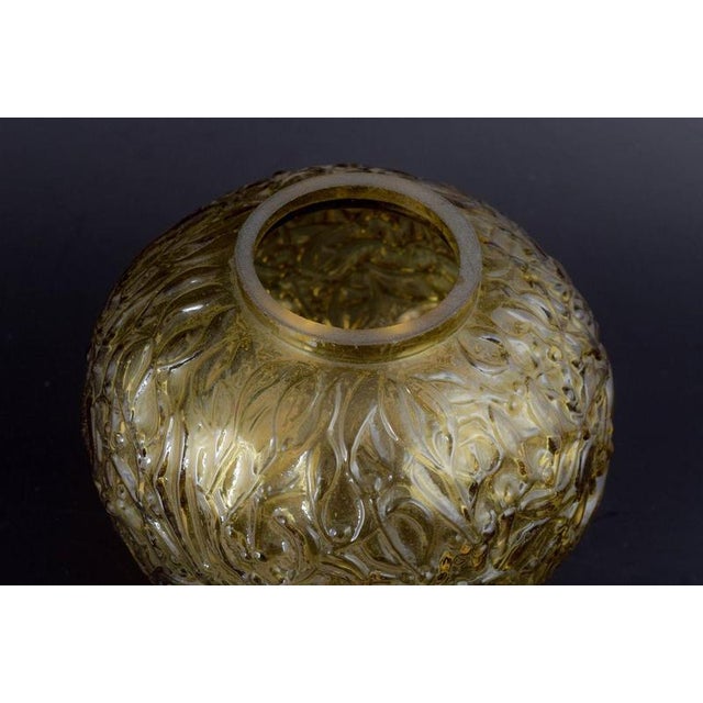 French Art Glass Maker Vase, mid-20th century. Decorative, mouth-blown vase in amber-coloured glass with deeply moulded...