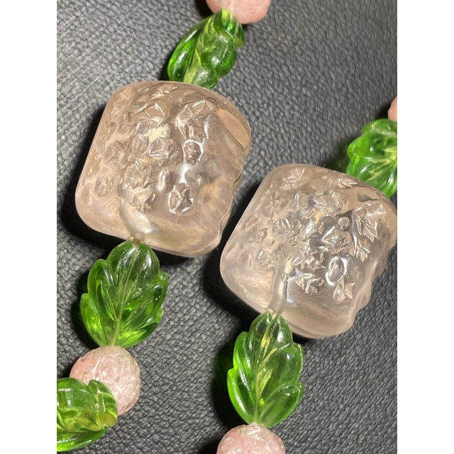 Vintage German Tutti Frutti style necklace measures 24 inches in length and features a vibrant array of molded and carved...