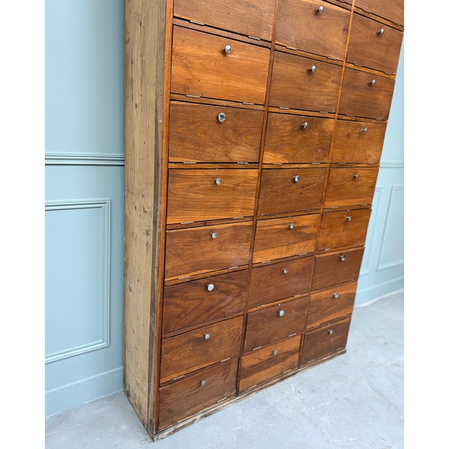 An iconic piece from bygone offices, this 1950s notary's cabinet embodies both the understated elegance and functionality...