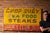 Painted roadside metal sign promoting Chop Suey, Sea Food, and Steaks, with a bold red banner along the bottom reading...