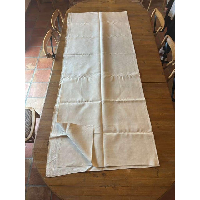 A quietly beautiful antique French linen sheet, monogrammed “LS,” discovered among a traditional trousseau—those carefully...