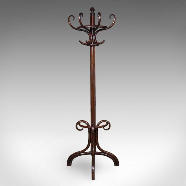 This is an antique half hall stand. An Austrian, bentwood reception coat tree by Thonet, dating to the late Victorian...